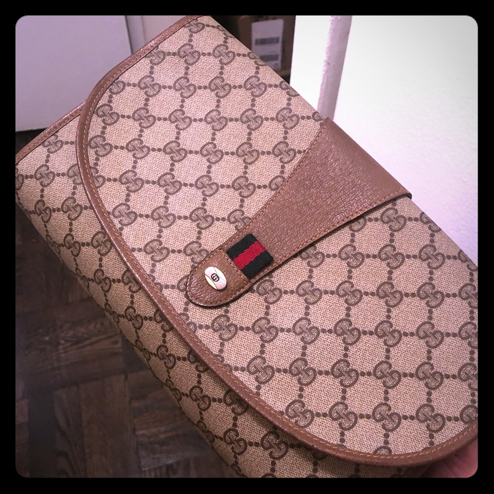 Authentic Gucci coated canvas brown clutch